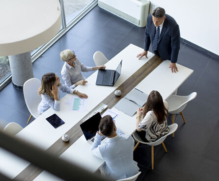 Aerial view of group business people working together in meeting office