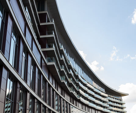 Modern glass building against clear sky